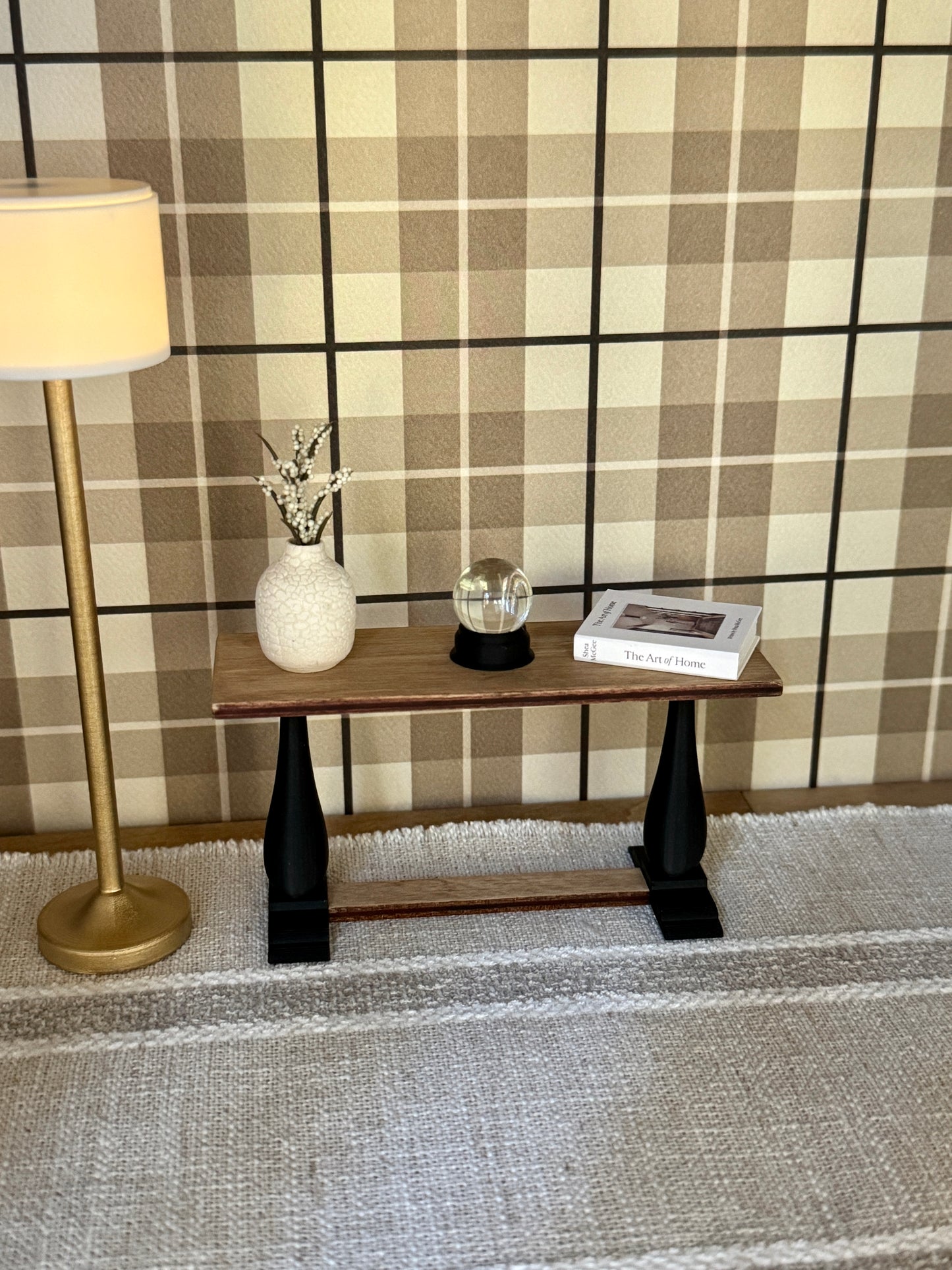 Miniature wood console table with black legs