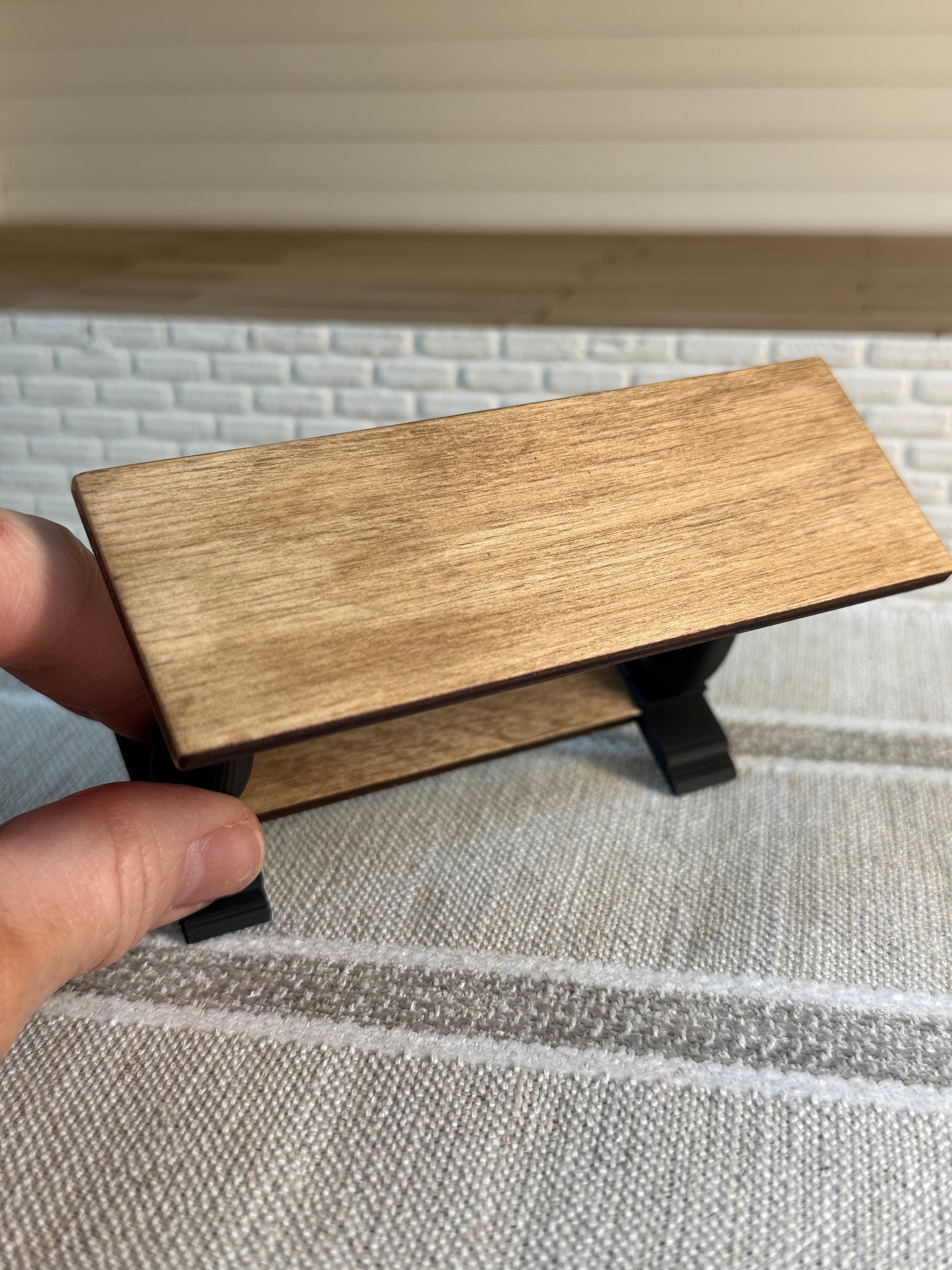 Miniature wood console table with black legs