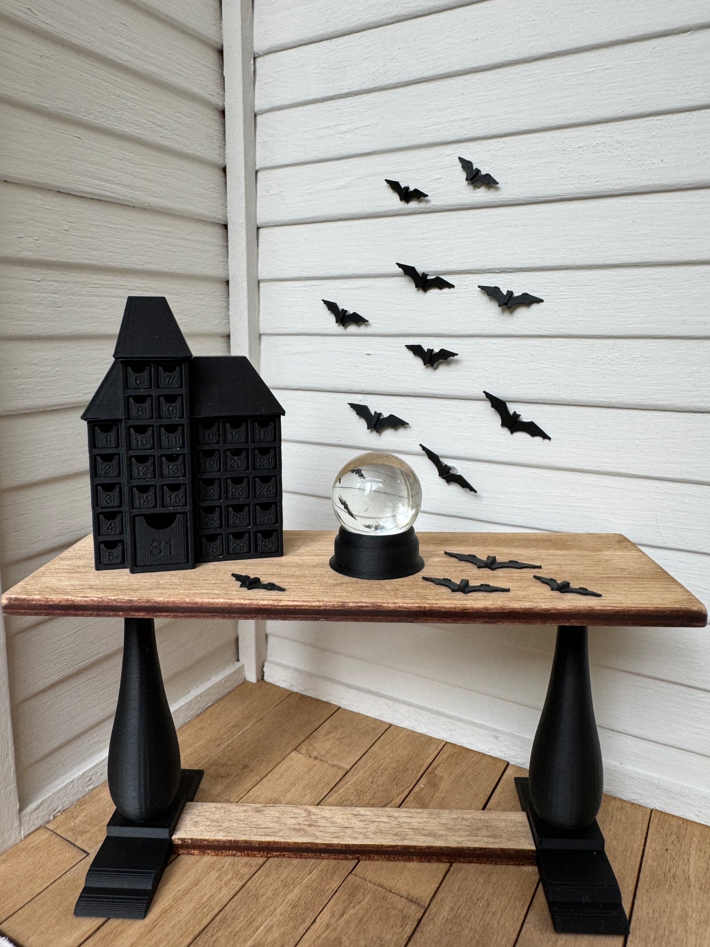 Miniature wood console table with black legs